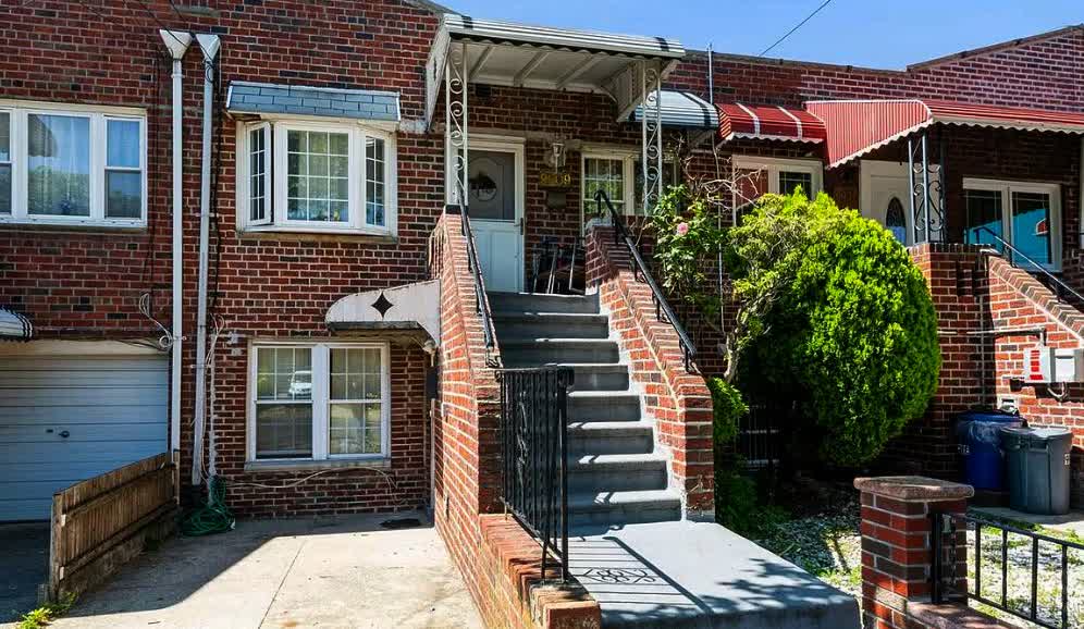 Two Family Brick “Mother-Daughter” style row houses.